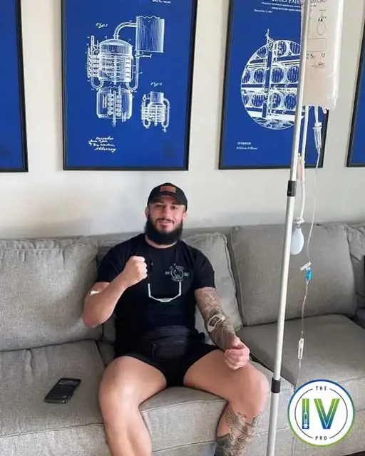 A patient relaxing on his couch during an at-home IV from The IV Pro